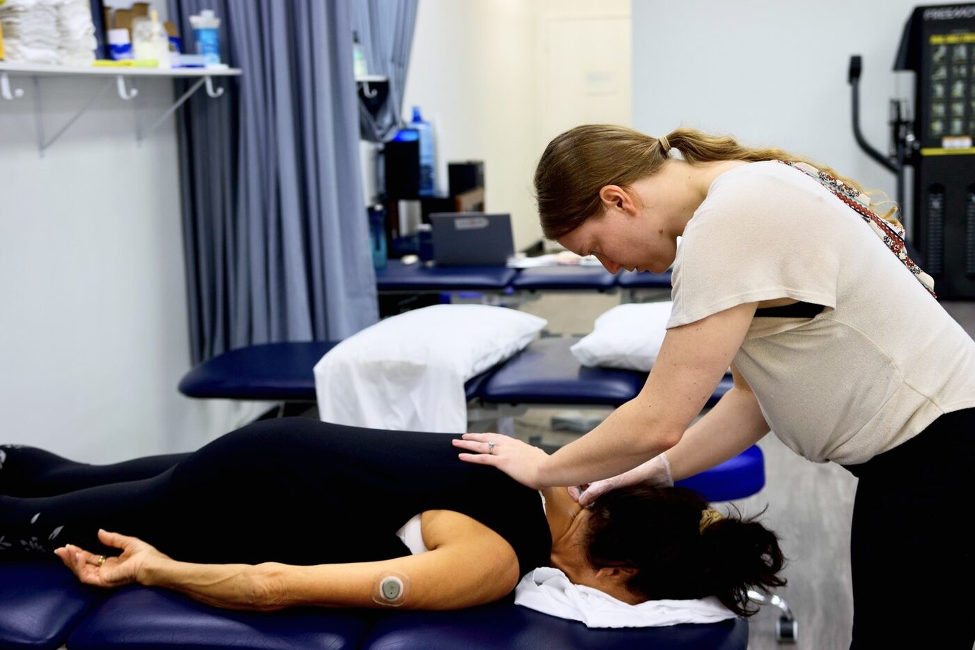 A Sports & Ortho therapist treating a patient at the Highland Park clinic