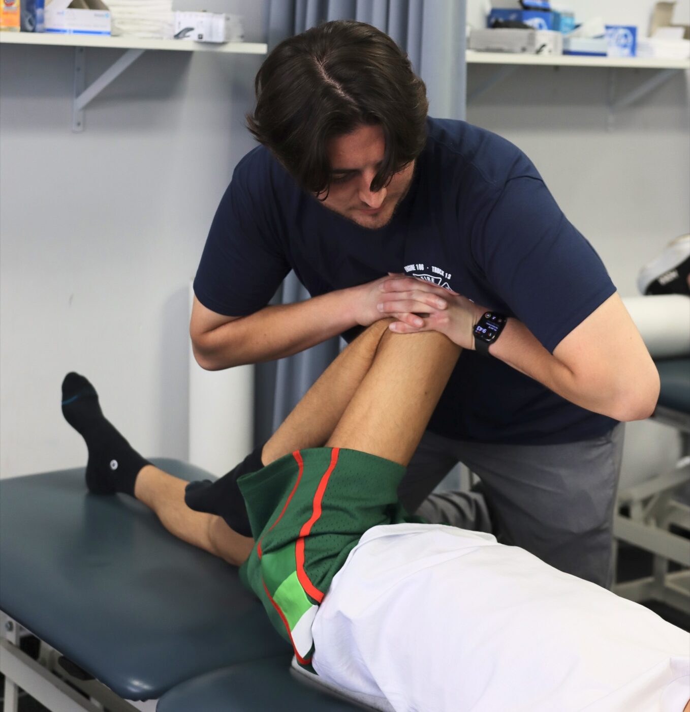 A Sports & Ortho therapist guiding an athlete through return-to-sport performance training