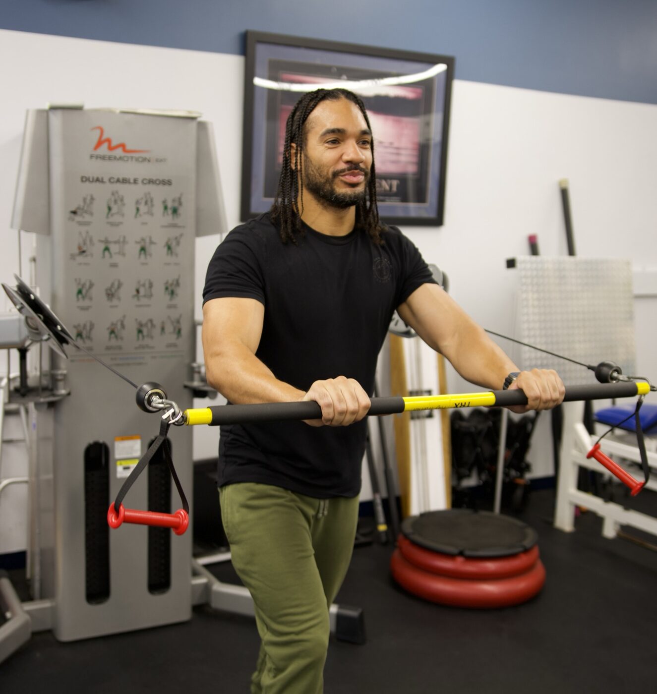 A Sports & Ortho therapist guiding a patient through a strengthening exercise