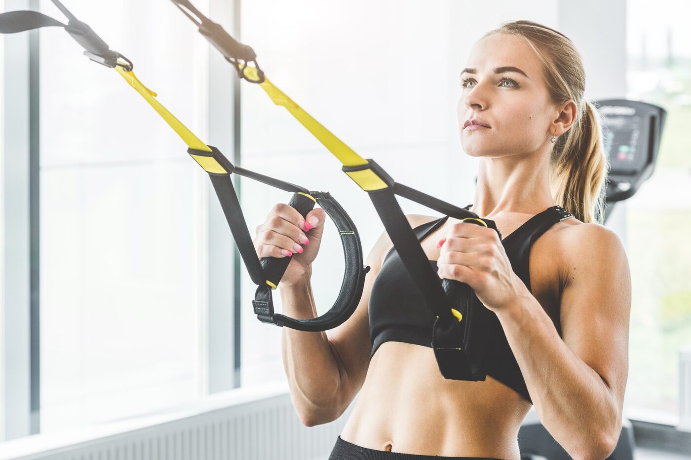 A patient training with TRX suspension straps