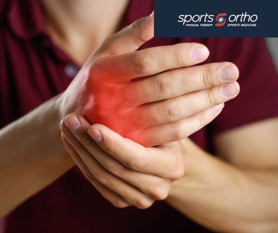 A person holds their hand in pain, with a red area highlighting discomfort on the palm.