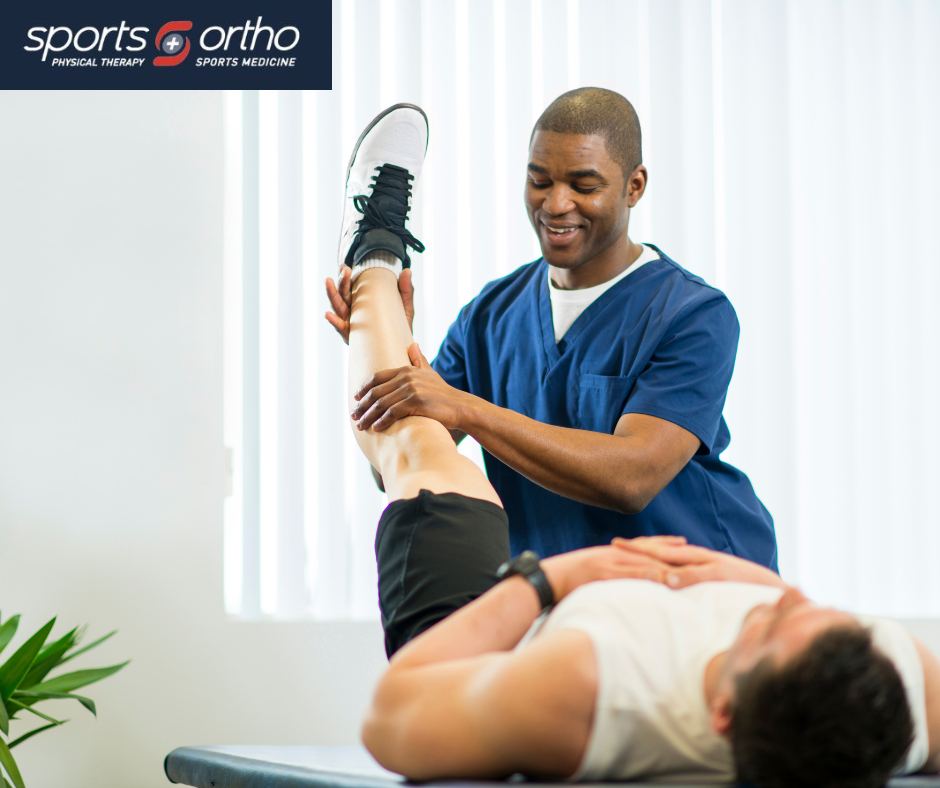 A sports physiotherapist assists a man in stretching his leg to enhance flexibility and prevent injury during rehabilitation.